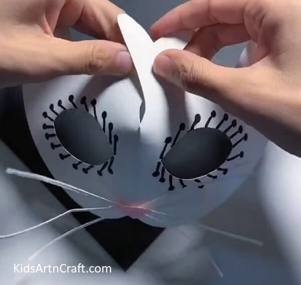 Shaping The Mask-A step-by-step explanation on how to make a paper mask for kids.