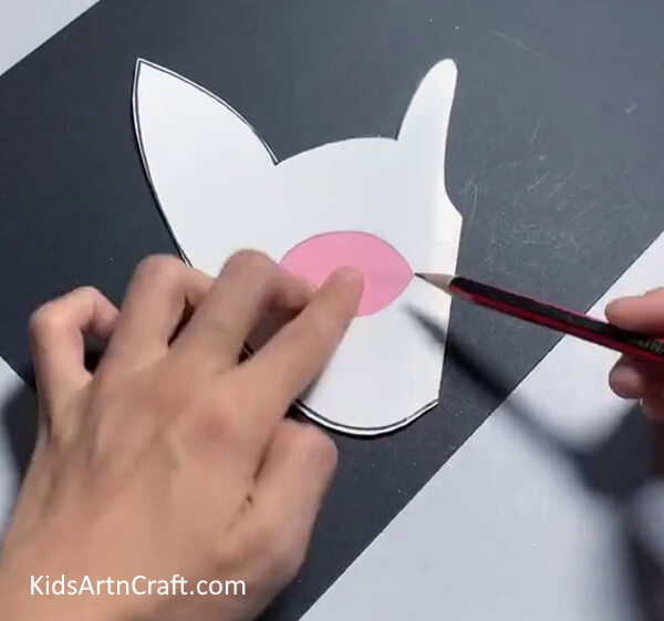 Outlining The Eye Shape- This tutorial will show kids how to make a paper mask of their own. 