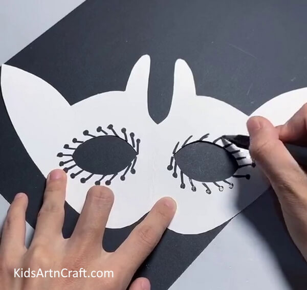 Decorating The Mask-Make your own paper mask with this tutorial for kids. 