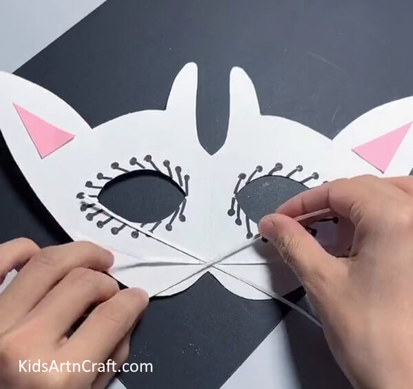 Preparing The Whiskers- A tutorial for children to build a paper mask of their own. 