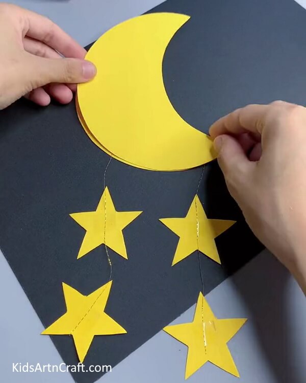 Pasting The Two Crescents Together-Creating a Wall Accessory with Paper Moons and Stars for Young People