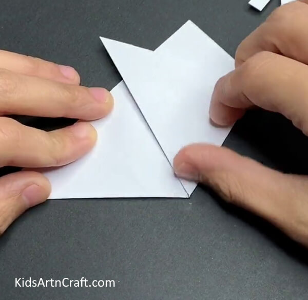 Take One Corner Of The Triangle And Fold It Upwards-Build Your Own Snowflakes from Paper - A Step-by-Step Tutorial for Children 