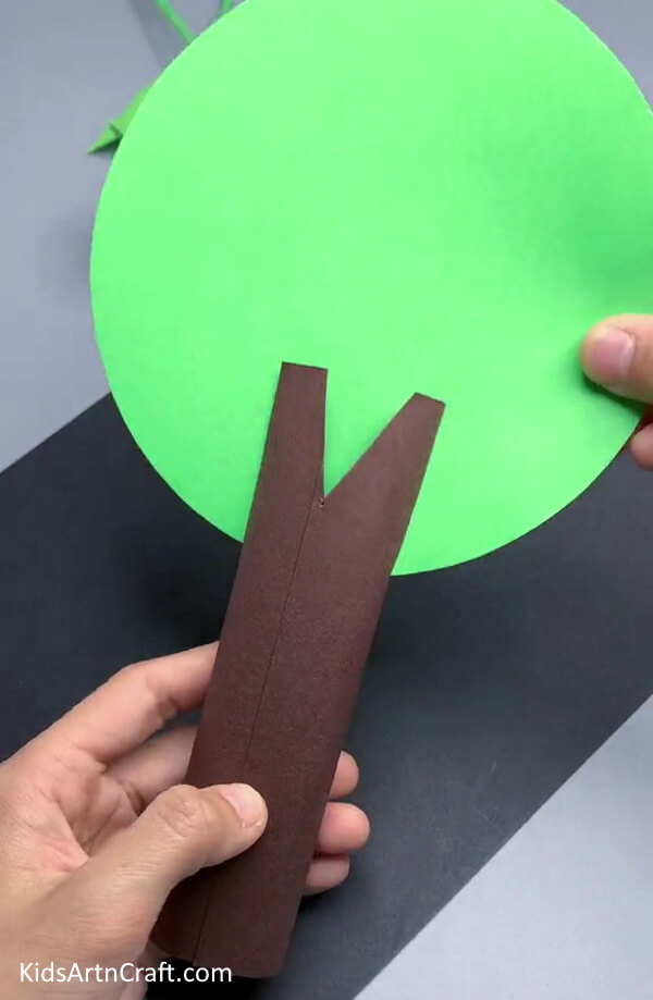 Insert a Green Circle Cutout In The Gap Crafting a Tree from Paper - An Easy Guide for Kids