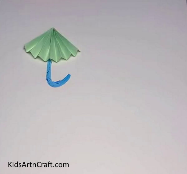 Paste The Cutout Using Adhesive- Build a Paper Umbrella with this straightforward tutorial! 