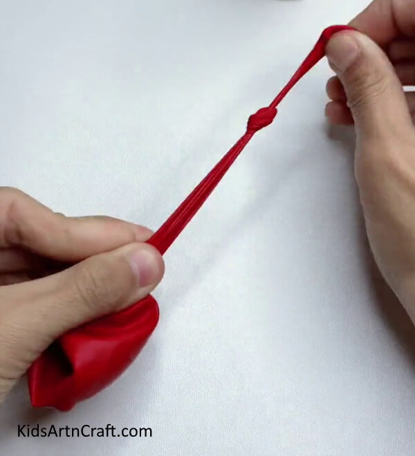 Knotting Balloon End - A Fun Way to Create a Party Popper for Kids