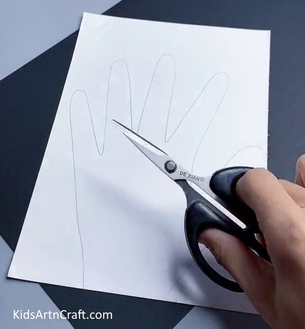 Cutting Handprint Out Of Paper - How To Make A Finger Puppet: A Detailed Guide 