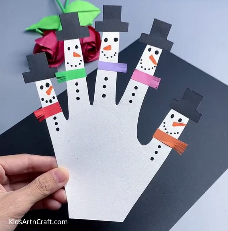 Construct a Snowman Finger Puppet for the winter season.