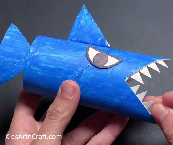 Making Teeth - An inventive way to utilize recycled cardboard tubes to make a shark craft for children.