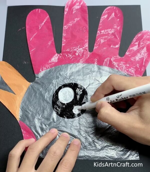 Making Eyes A craft activity for kids with disposable gloves