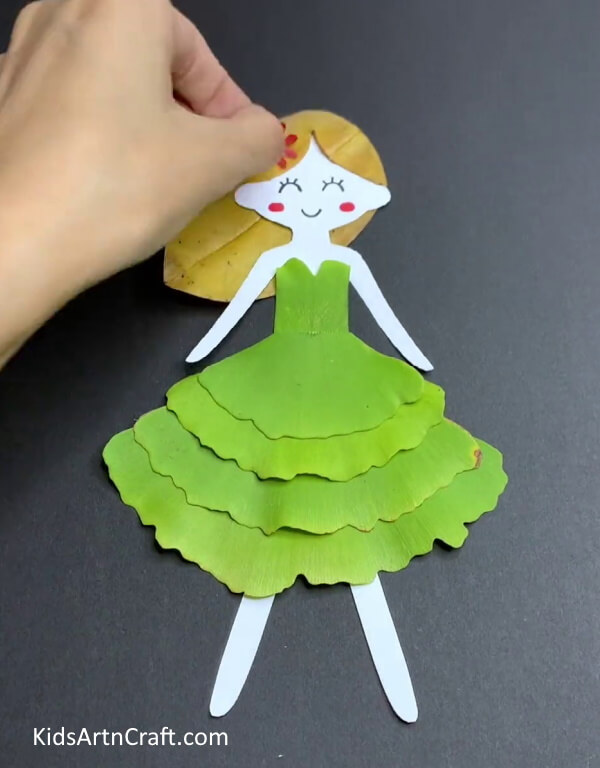 Detailing The Lady's Face- Children's Autumn Leaf Art Step-By-Step Guide 