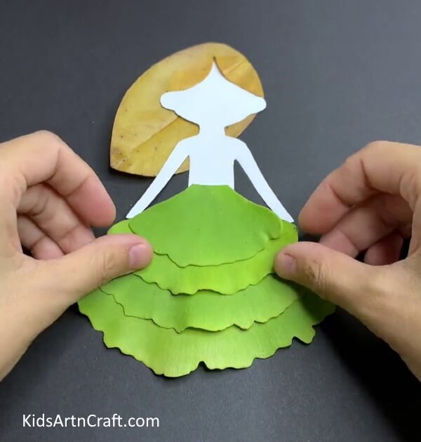 Pasting The Gown On The Girl- Step-By-Step Leaf Art Tutorial For Kids In Fall 