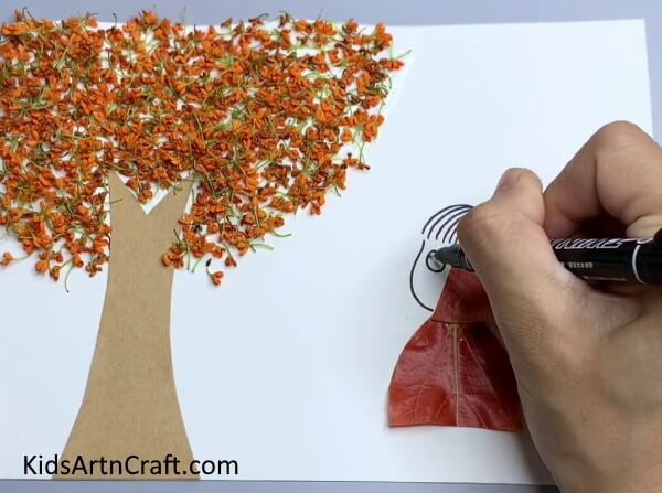 Drawing Girl Using Black Marker - Delightful Leaf Art Projects For Kids