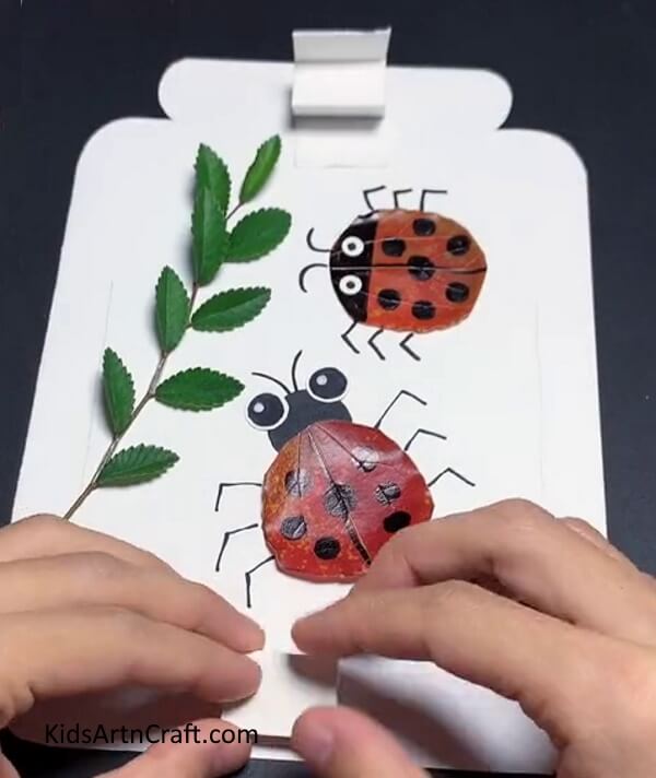 Pasting Paper Support In Bottom - Home-Made Ladybugs from Paper & Leaves