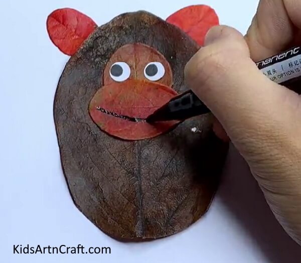 Add a Smiling Face Using a Marker- Leaf Art and Craft Instructions for Kids 