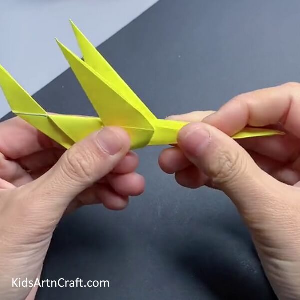 Folding Paper Upwards - Learn to fold a paper airplane step-by-step