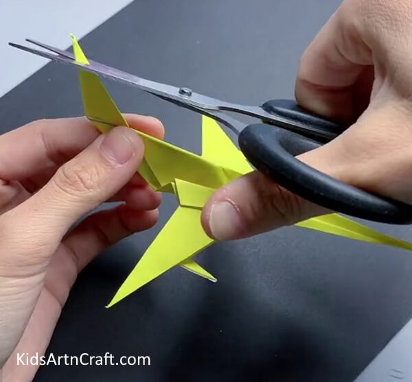 Cutting Top Of The Tail - A tutorial to help make a paper airplane 