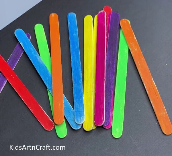 Coloring All The Popsicle Sticks - Lovely Paper Cloud Rainbow Project For Toddlers To Assemble