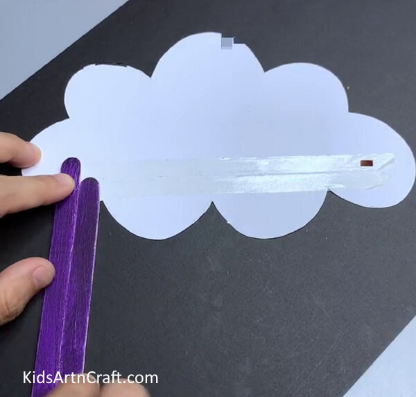 Pasting Colored Popsicle Sticks  - Adorable Paper Cloud Rainbow Construction For Youngsters To Construct