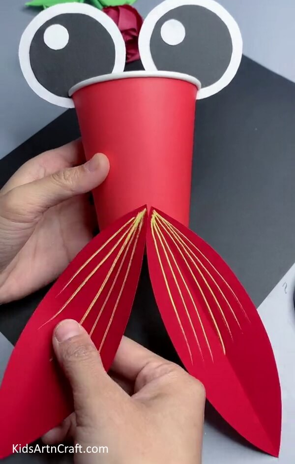 Pasting Tail On The Paper Cup - Make a Fish Craft Out of Pre-Used Paper Cups Easily