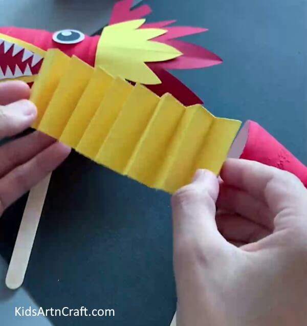 Making Dragon's Body Using Paper - A simple and enjoyable activity for children to construct a dragon using paper and plastic bottles. 