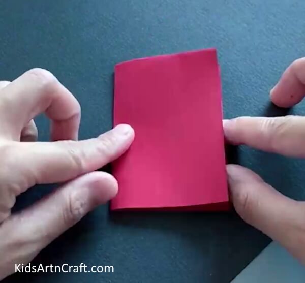 Folding Rectangle In Half - A simple paper and plastic bottle dragon craft perfect for children. 