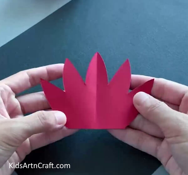 Making Crown Shape - Kids can make a dragon using paper and a plastic bottle in this craft. 