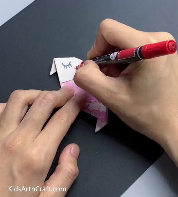Drawing Eyes and Cheeks - Crafting a Paper Bird with Step by Step Directions 