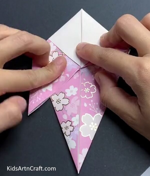 Bringing Down The Top Layer - How to put together a paper bird with this tutorial.