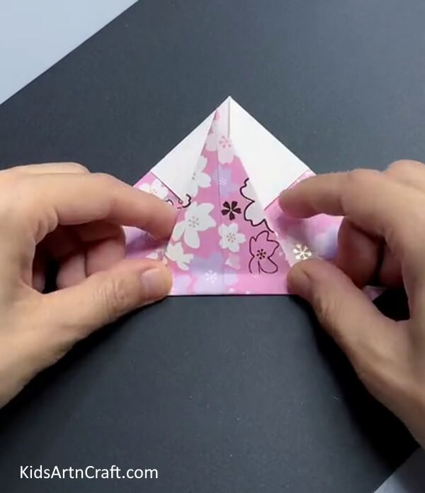 Folding Bottom Triangle Upwards - This paper bird craft tutorial has step-by-step directions.