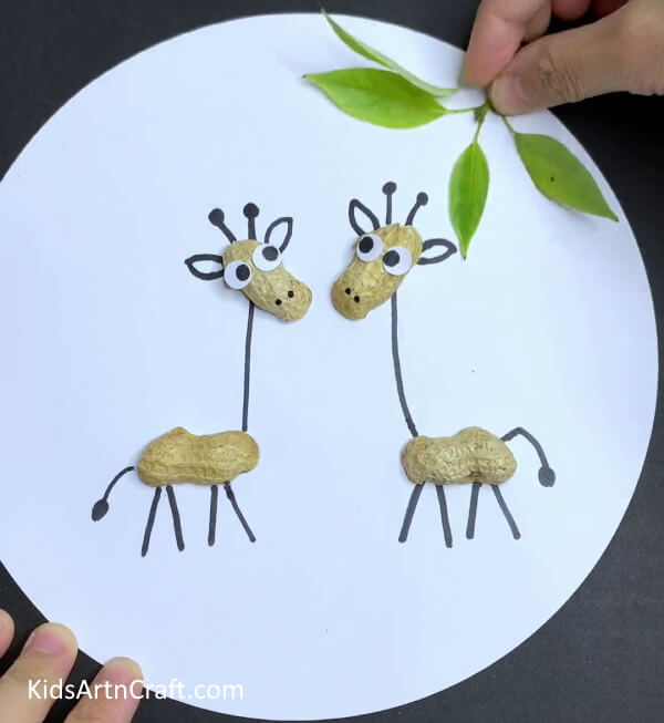 Pasting Leaves - Crafting a Giraffe Decoration Out of Peanut Shells