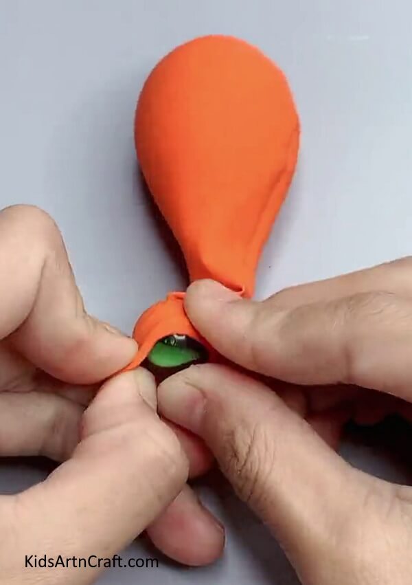 Inserting Marble Ball Into Balloon - Crafting a Halloween Balloon Craft Easily