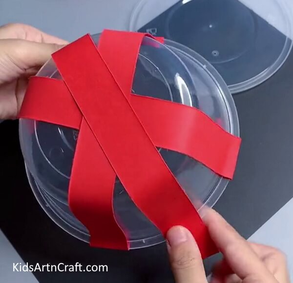 Pasting Red Paper Strips - Simple Step-by-Step Guide to Constructing a Ladybug with Lightning for Children