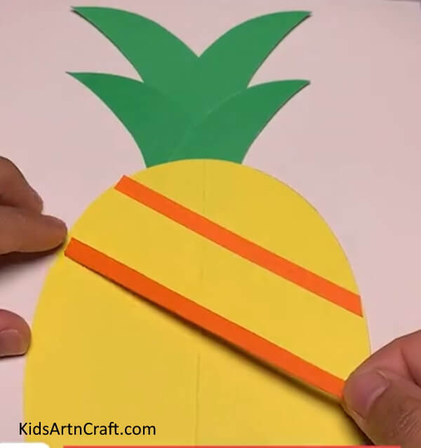 Pasting Orange Strips - Making a Paper Pineapple with Step-by-Step Instructions