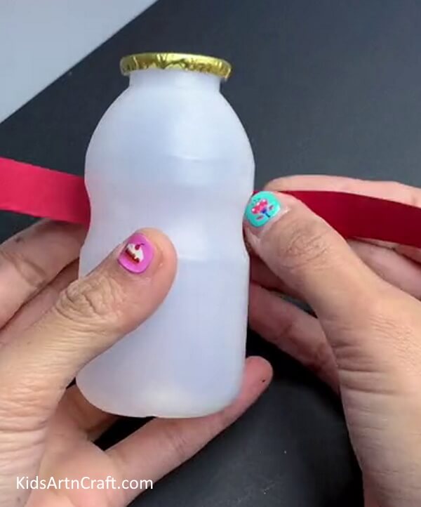 Wrapping Ribbon On Bottle - Crafting a Snowman using a Bottle - A Guide 