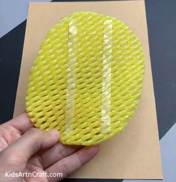 Applying Double Side Tape - Making a Pineapple Fruit Art Piece with Foam Net