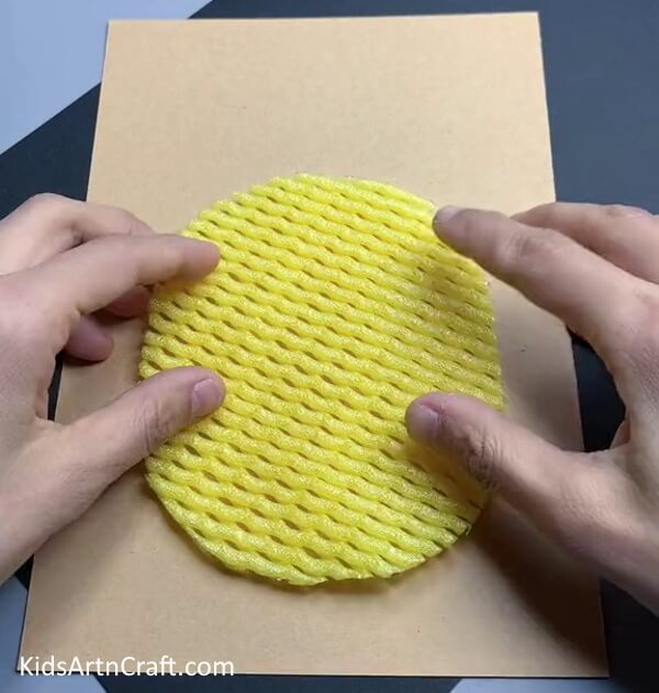 Pasting Pineapple On Cardboard - Creating a Pineapple Fruit Craft Utilizing Foam Netting
