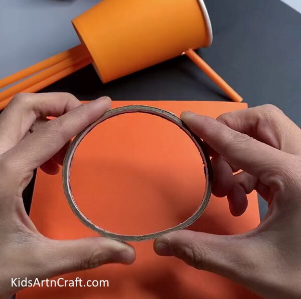 Make a Circle On Orange Craft Paper-Let the Kids Have Fun and Make Tigers from Reclaimed Paper Cups 