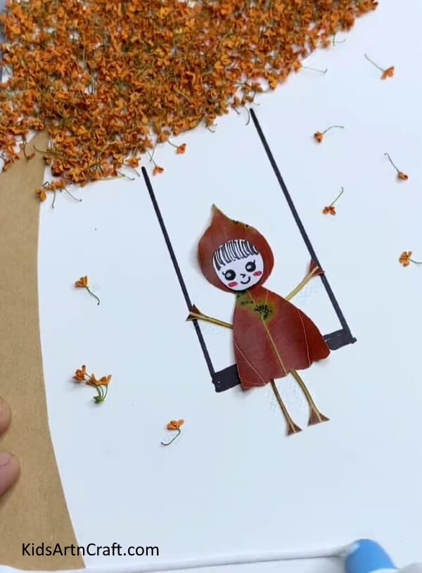 Pasting Some Dried Leaves - Demonstrating a Girl Swinging on a Tree Leaf Project for Children 