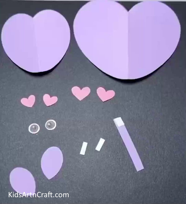 Cut Out Multiple Shapes From Different Sheets Of Paper-Here's how to make a mouse out of a heart-shaped sheet of paper.