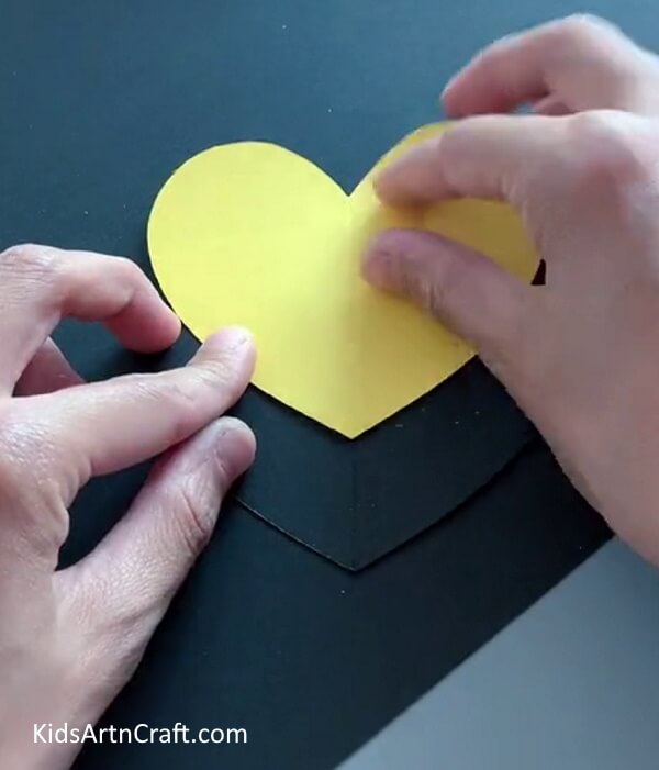 Pasting Yellow Heart  - Crafting a Heart-Shaped Bee Using Paper: A Tutorial