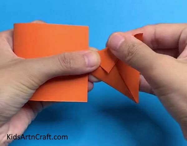 Folding The Cut Part Into A Triangle- Create a Charming Fish Using Paper 