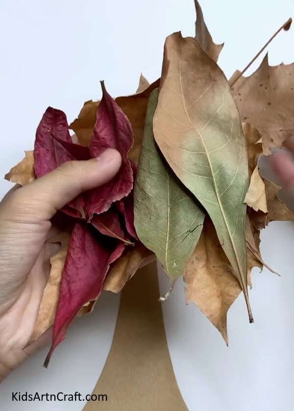 Getting Fallen Leaves - A crafty, autumnal tree, made from recycled leaves.