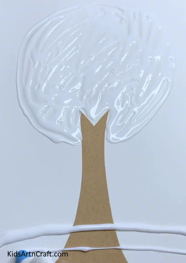 Spreading Glue - A simple fall tree craft created with second-hand leaves.