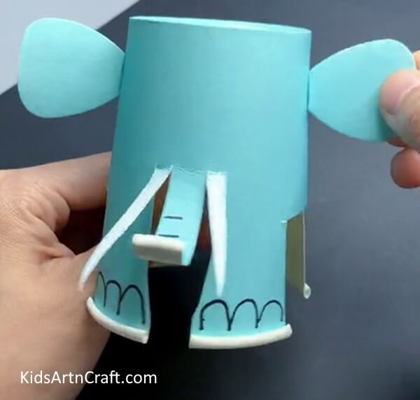 Pasting Ears To Make An Adorable Head Here is how to create an elephant out of a paper cup for children.
