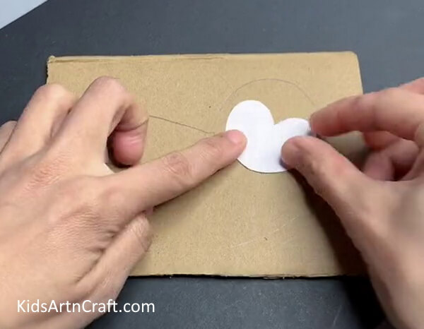 Pasting Heart Shape On Monkey - Instructions For A Kid-Friendly Animal Craft That Can Be Hung Up