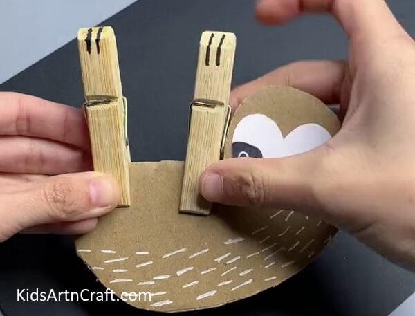 Attaching Pins On Monkey - Directions For A Simple Animal Craft Project That Hangs
