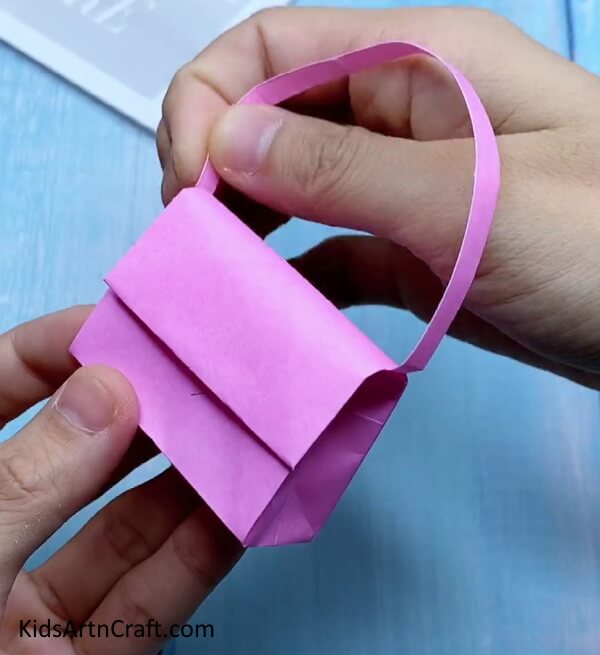 Attaching Handle - Kids can make their own mini origami paper bag. 