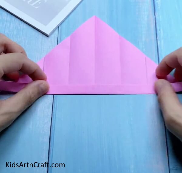 Making Creases - Kids will have fun making a minuscule origami bag.