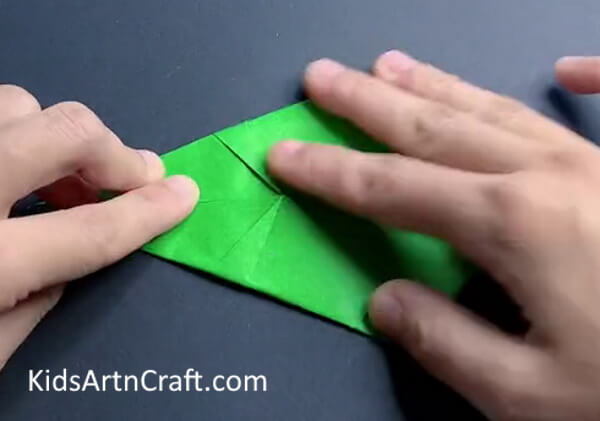 Folding Top Left Side - Learn how to fold a paper dinosaur with this origami tutorial.