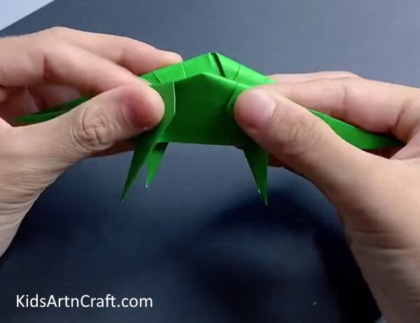 Folding Craft In Half - Get the instructions for making a dinosaur paper craft using origami.
